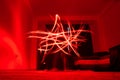 Red light traces in a star shape from long exposure shot