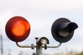 Red light at the traffic light at the railway crossing. Close up. Royalty Free Stock Photo