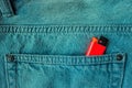 Red lighter in the back pocket of jeans.