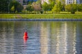 red lighthouse buoy on the river without a ship Royalty Free Stock Photo