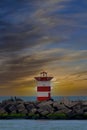 Red lighthouse in Den Haag, the Hague in Netherlands with a sunset as background Royalty Free Stock Photo
