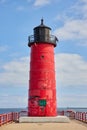 Red Lighthouse with Graffiti on Milwaukee Pier, Partly Cloudy Sky Royalty Free Stock Photo