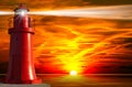 Red Lighthouse with Light Beam at Sunset Royalty Free Stock Photo