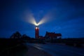 Lighthouse lightbeams in night Royalty Free Stock Photo