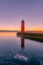 Red lighthouse on a long pier in Milwaukee, Wisconsin on Lake Michigan