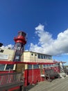 Red Lighthouse mounted atop a ship