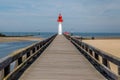 Red lighthouse in Trouville, famous resort in Normandy, France. Royalty Free Stock Photo