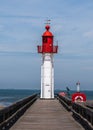 Red lighthouse in Trouville, famous resort in Normandy, France. Royalty Free Stock Photo