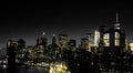 Red Lights Of Manhattan Night Skyline Shining Against A Black And White Cityscape Of Downtown New York City