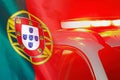 Red lights on top of Portugal police car on the background of the Portugal flag