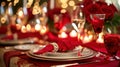 Red linens, elegant dinnerware, and romantic candlelight