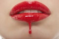 Red Lipgloss Dripping From Woman's Lips Royalty Free Stock Photo