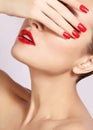 Red lips and bright manicured nails. open mouth. Beautiful manicure and makeup. Celebrate make up and clean skin Royalty Free Stock Photo