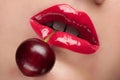 Red lips with a cherry.
