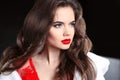 Red lips makeup. Beautiful brunette portrait. Fashion girl model Royalty Free Stock Photo