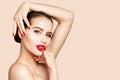 Red Lips and Nails, Woman Beauty Make Up, Red Lipstick. Skin Care Cosmetology. Beautiful Girl Face Makeup Royalty Free Stock Photo