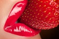 Red lips with strawberry.