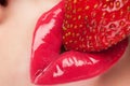 Red lips with strawberry.