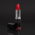 Red lipstick on black background Royalty Free Stock Photo