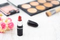 Red lipstick with decorative cosmetics collection set. Selective focus with copy space