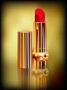 Red lipstick in gold tube. Created with gradient meshes. Royalty Free Stock Photo