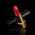 Red lipstick isolated on black
