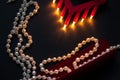 Pearl necklace, silk handkerchief on a black background Royalty Free Stock Photo