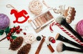 Red lipstick and makeup brushes with christmas decorations on wooden background Royalty Free Stock Photo