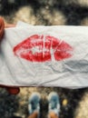 Red lipstick print on a napkin