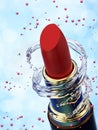 Red lipstick in water splash