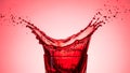 Red liquid splash in glass Royalty Free Stock Photo