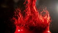 Red Liquid Splash in Midair with Dynamic Motion and Bright Highlights Royalty Free Stock Photo