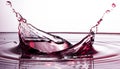 Red liquid water splash with drops Royalty Free Stock Photo