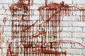 The red liquid on the white brick wall is a beautiful decor. Royalty Free Stock Photo