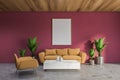 Red living room with beige sofa and poster Royalty Free Stock Photo