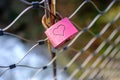 Red Lock with a heart symbol on a rope bridge Royalty Free Stock Photo