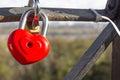 Red locks in the form of a heart. Metal locks. A bunch of locks. Heart locks