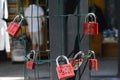 Red locks with names at a fence