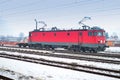Red locomotive on a foggy winter day Royalty Free Stock Photo