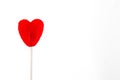 Red lollipop with heart shape isolatedbackground. Royalty Free Stock Photo