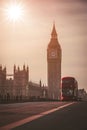 Red London Bus on the Westminster Bridge and Big Ben Tower in the background Royalty Free Stock Photo