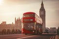 Red London Bus on the Westminster Bridge and Big Ben Tower in the background Royalty Free Stock Photo