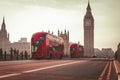 Red London Bus on the Westminster Bridge and Big Ben Tower in the background Royalty Free Stock Photo