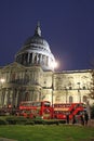 Red London buses outside St Paul`s Cathedral