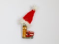 Red London double decker bus and Big Ben tower as magnet with Santa Claus hat