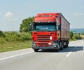 Red lorry with trailer on highway Royalty Free Stock Photo