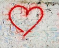 Red Love Heart hand drawn on brick wall grunge textured background Royalty Free Stock Photo