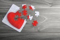 Red love heart puzzle with loose pieces