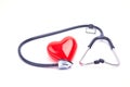 Red love heart and stethoscope on the table