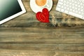 Red love heart, tablet pc, coffee. Valentines Day workplace Royalty Free Stock Photo